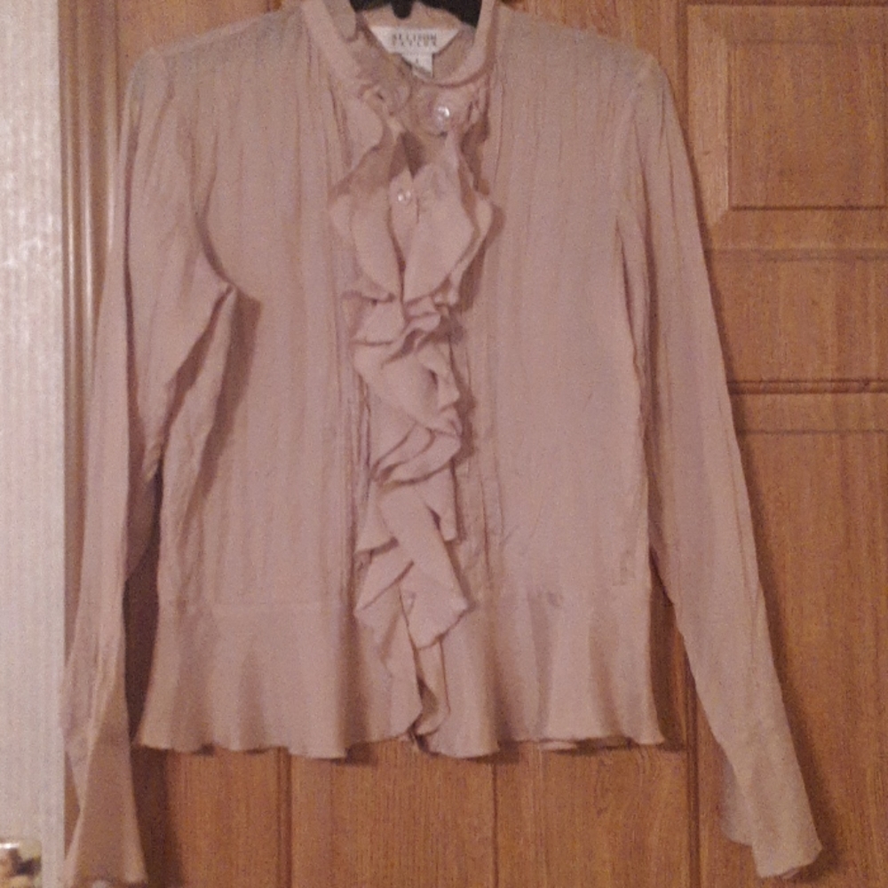 A tan silk ruffle button up shirt